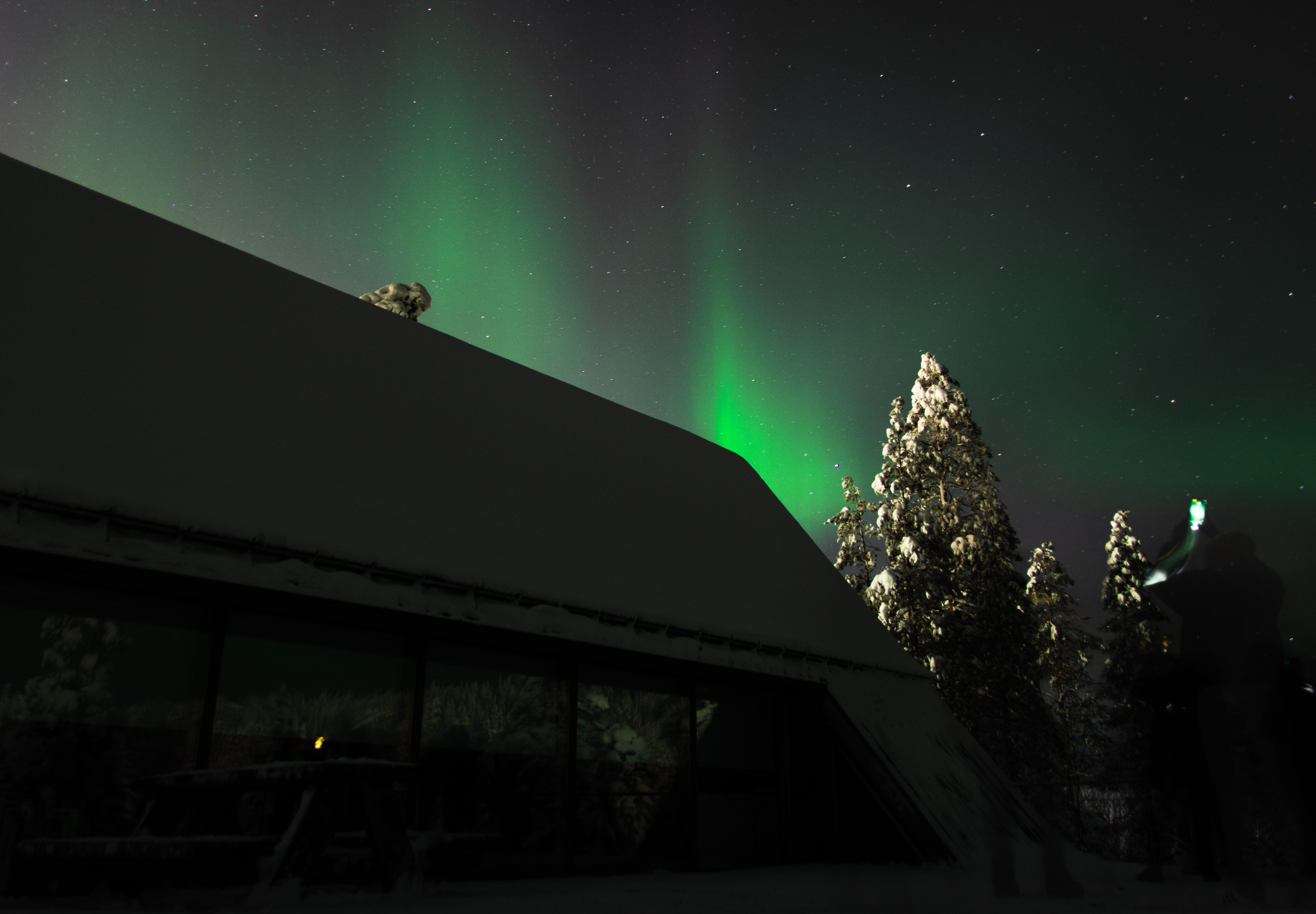 Northern lights above a cabin in Finland